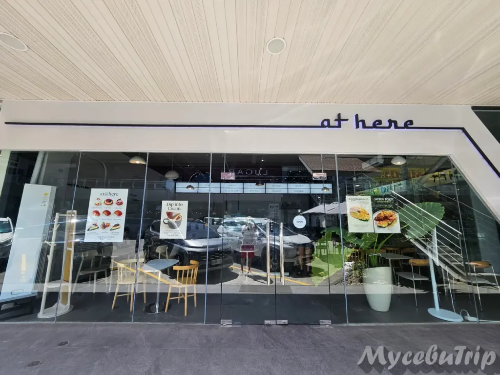 Clean and modern storefront exterior of AT@HERE, a popular Korean bakery near Mactan Newtown.