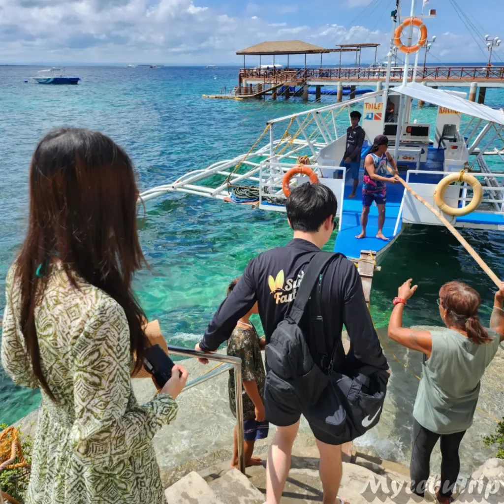 Tourists boarding the private boat at MyCebuTrip Mactan dock