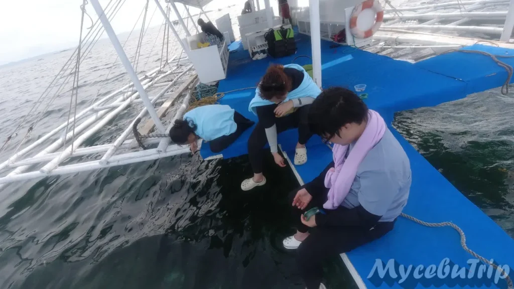 Enjoying handline fishing on the boat in Cebu