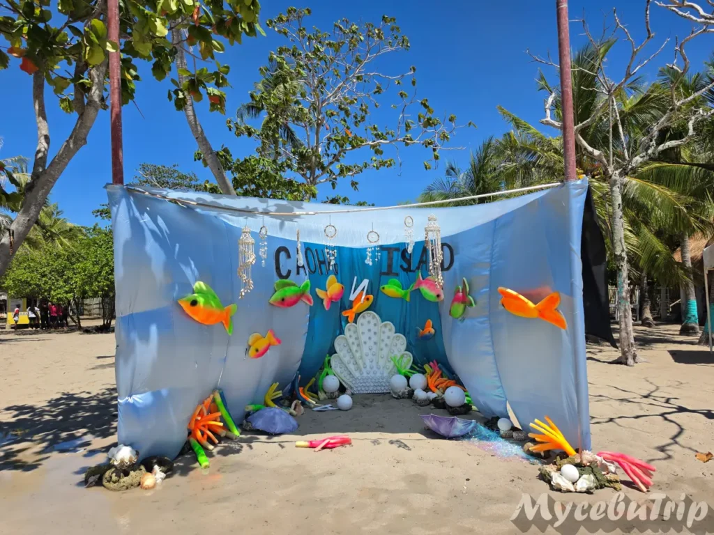 Sea-themed photo booth with the Caohagan Island sign, a popular photo spot on this Cebu hopping tour
